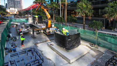 Installation of the chrome bus sculpture underway in Parramatta